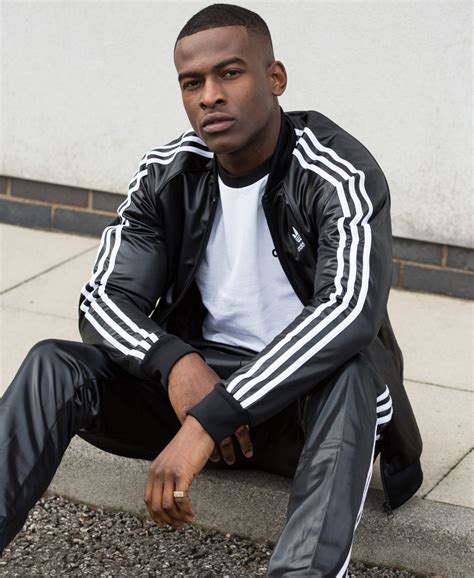 adidas tracksuit sitting.